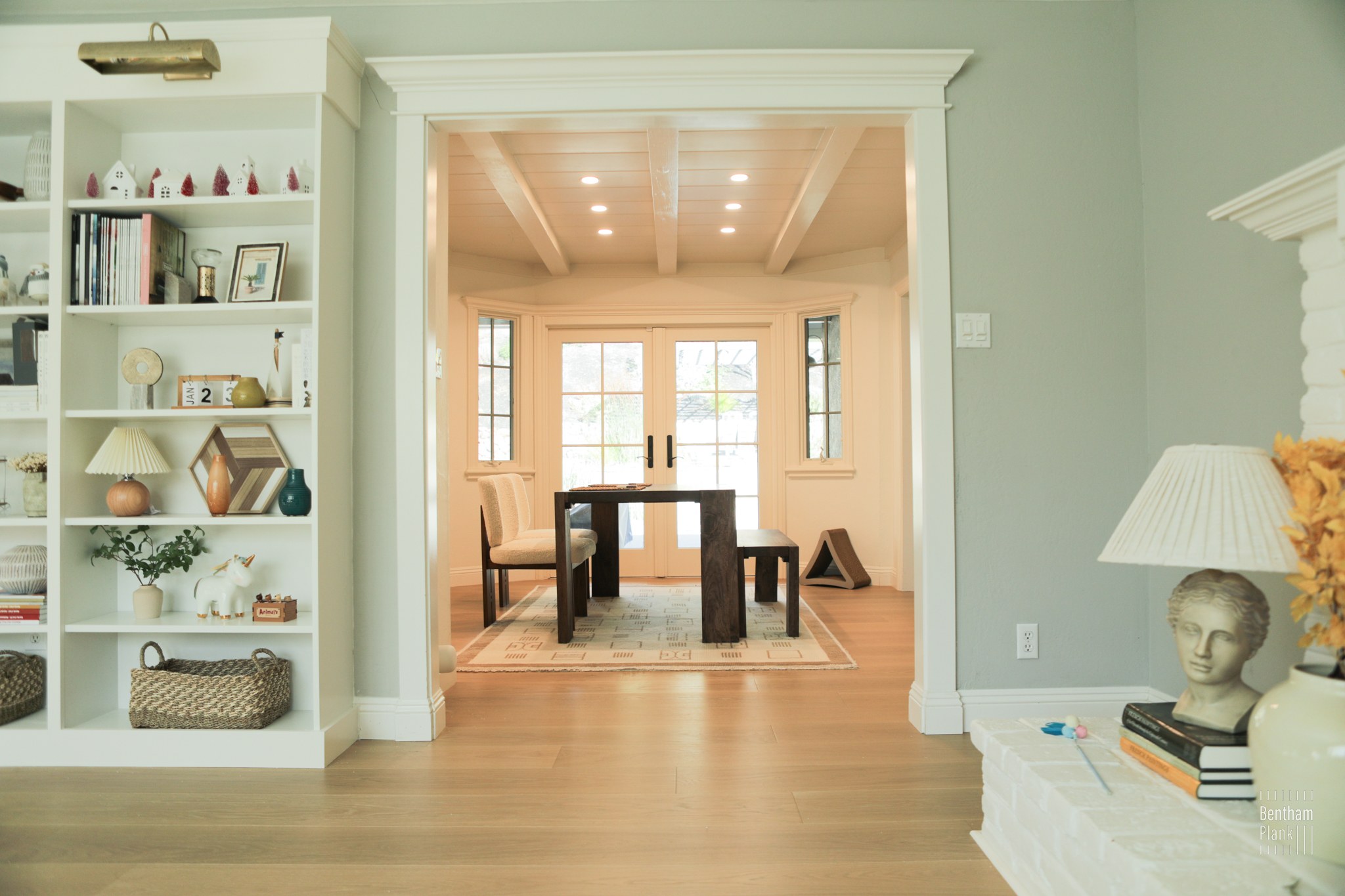 Connected rooms with continuous wood flooring