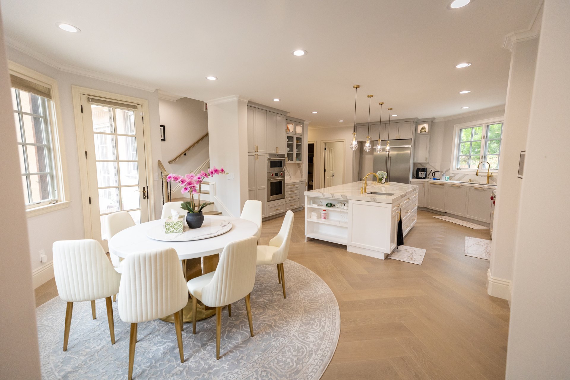 Coordinated cabinetry, flooring, and windows in a Royalwood project