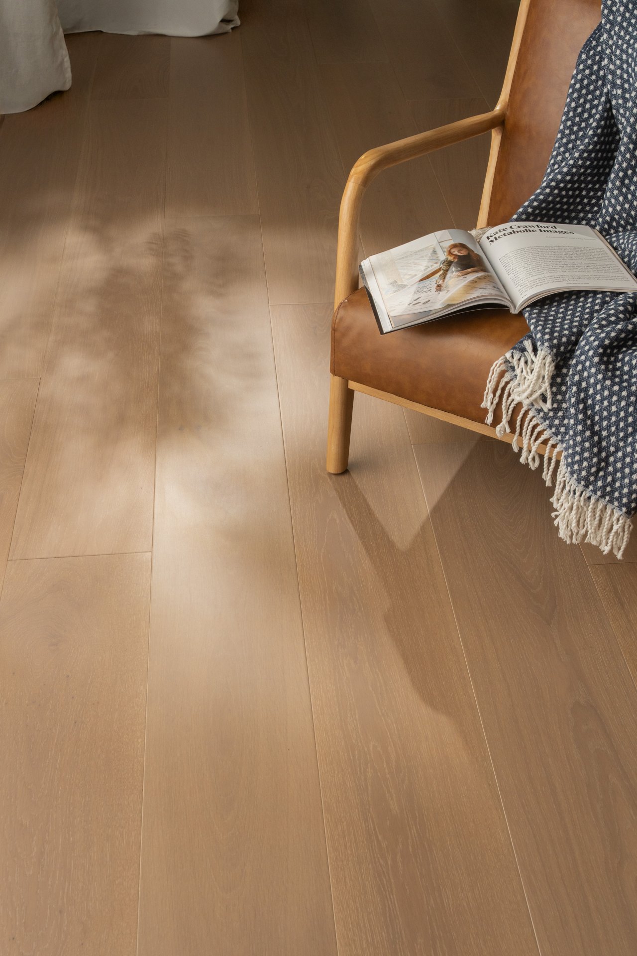 Warm-toned flooring with a reading chair